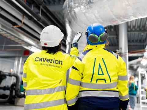 Two technicians pictured from behind