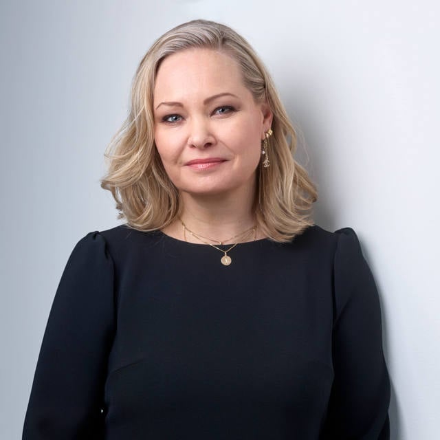 Blonde woman in black clothes (Noora Koikkalainen Head of Marketing, Communications, IR and Sustainability
Caverion Group)