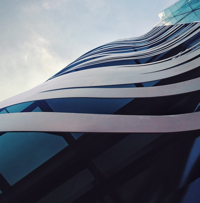 A close up picture of a building against a grey sky