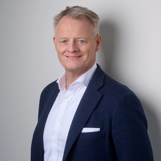 Jacob Götzche, president of Assemblin Caverion Group pictured in a suit.