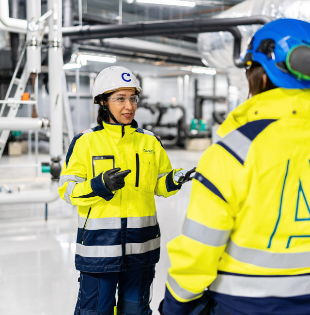 Two technicians talking with each other