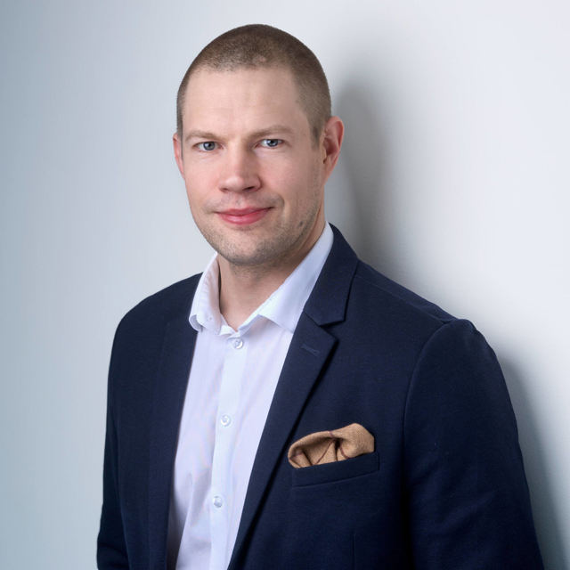 Man pictured in a suit.